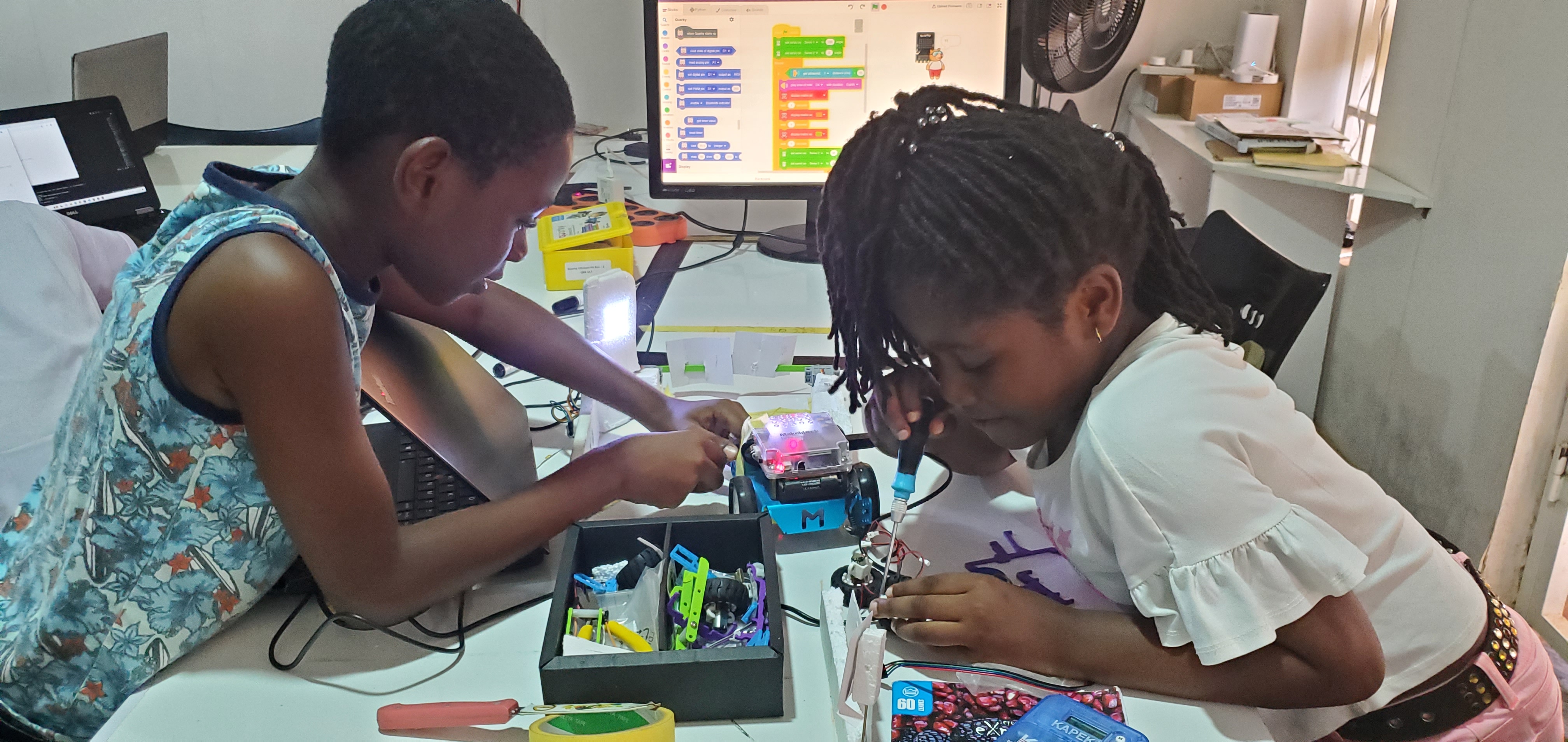 Young learners collaborating on beginner coding tasks