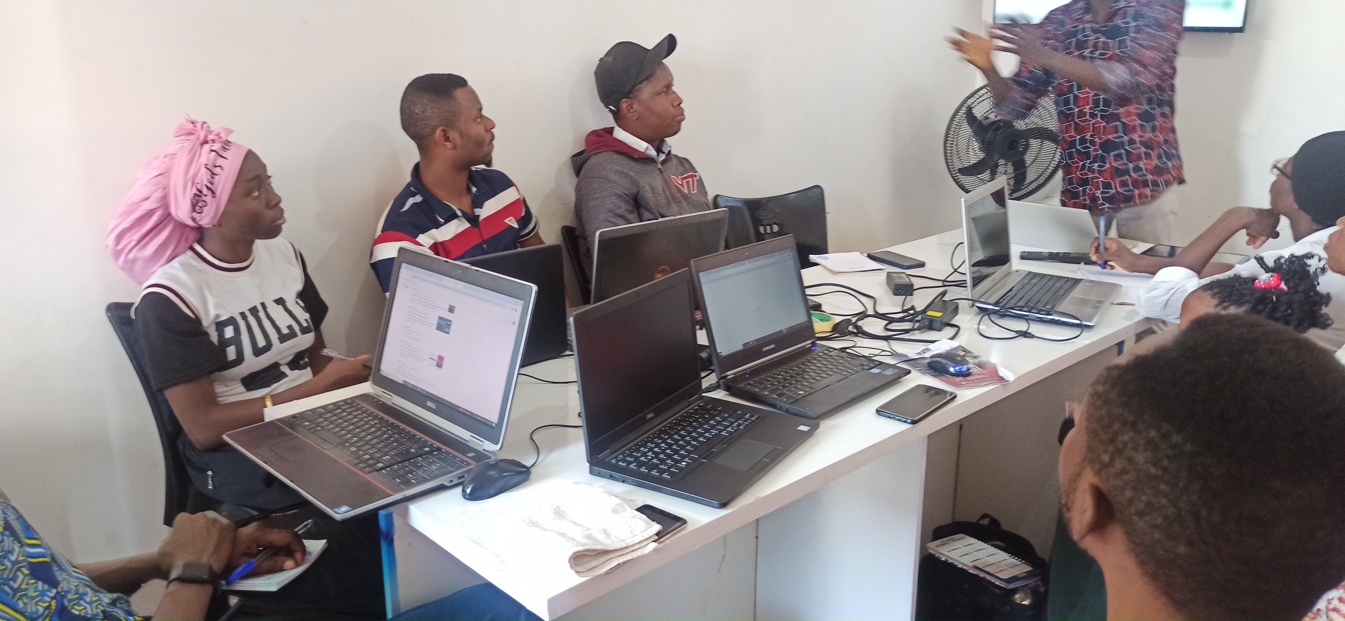 Students writing frontend code during web development class