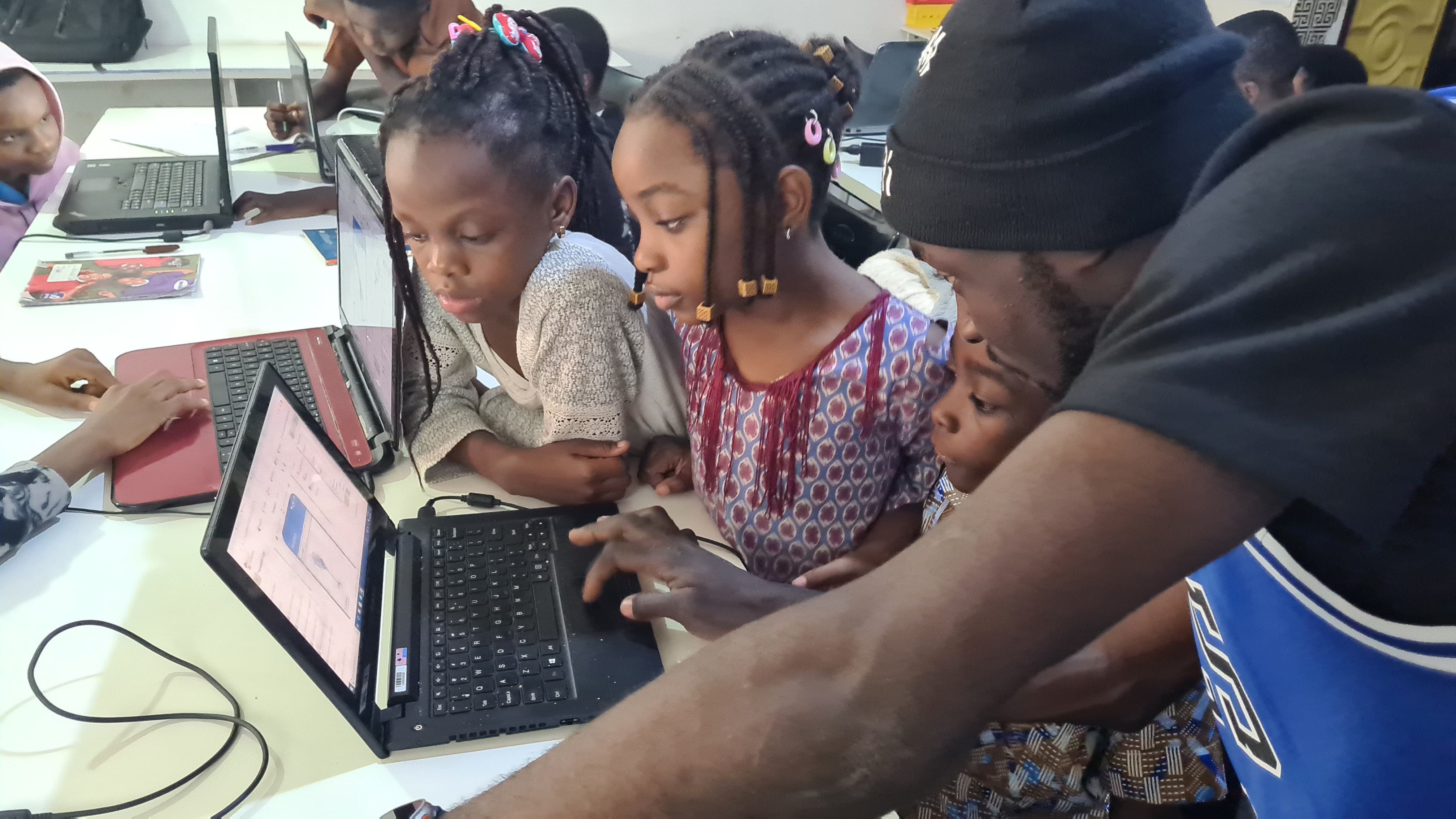 Children in summer coding class building projects