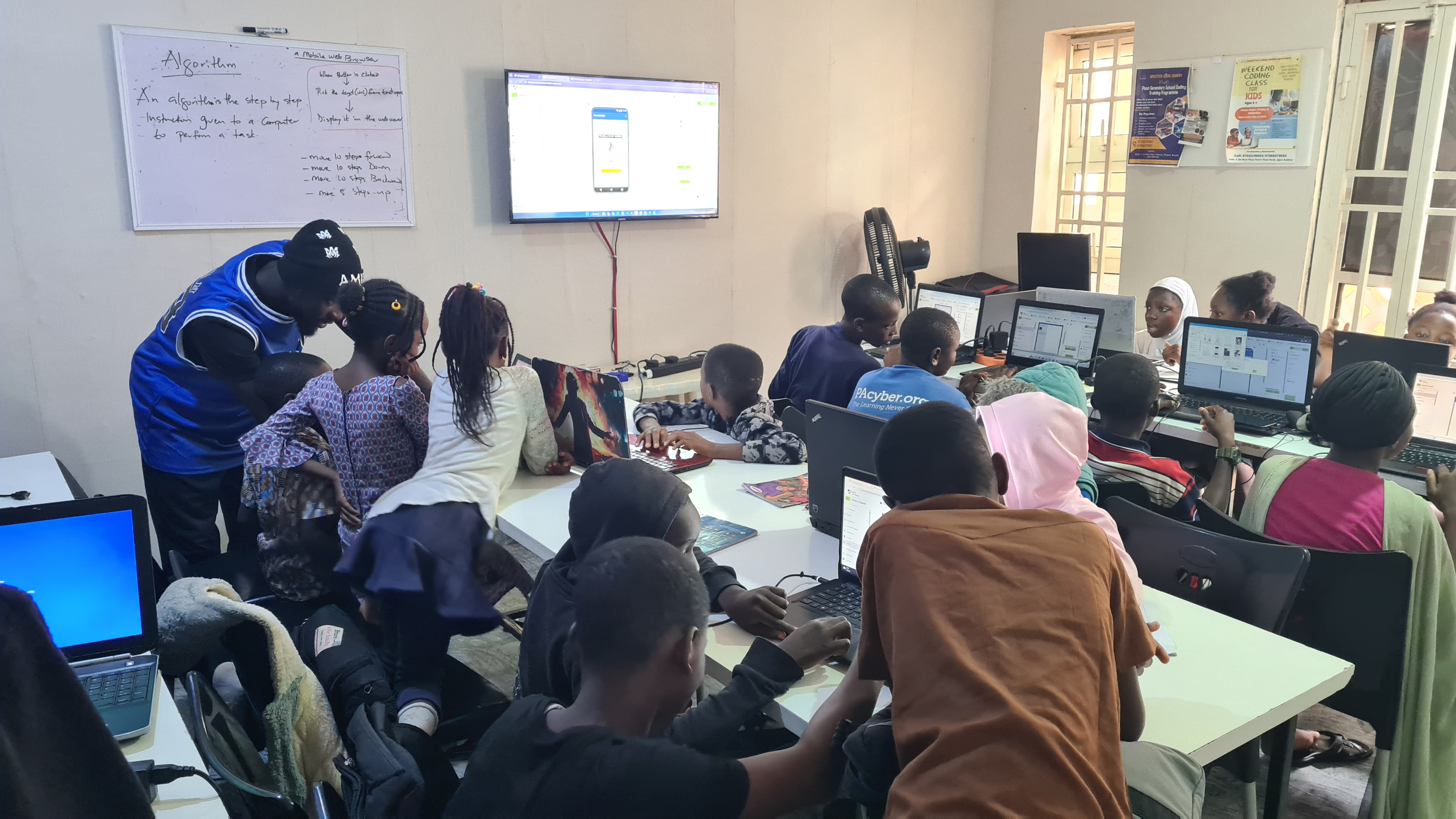 Students engaging with coding activities locally